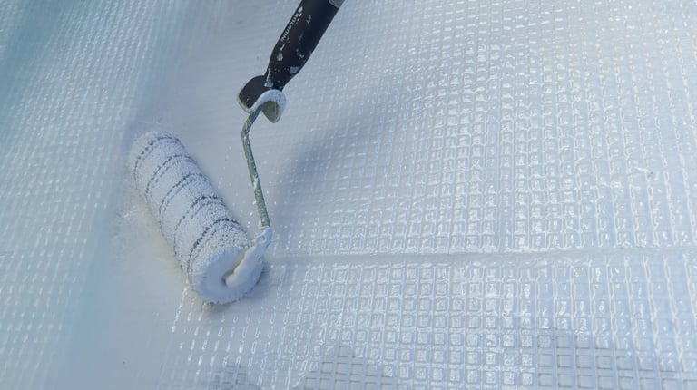 Applying waterproof resin coating with roller tool